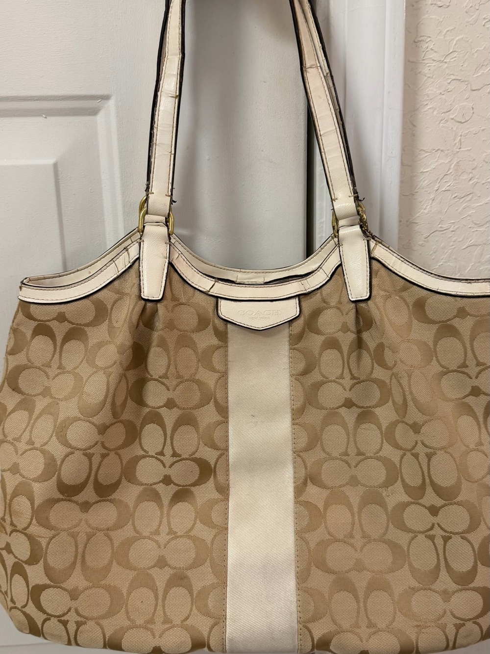 Coach Signature Canvas Beige Tote Bag with Ivory Trim handles are cracked!
